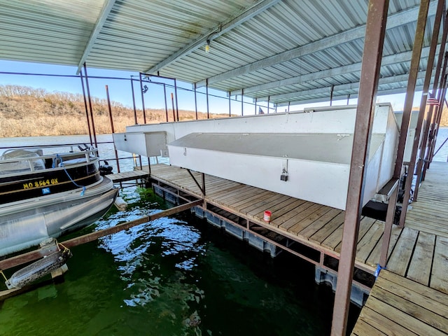 view of dock with a water view and boat lift