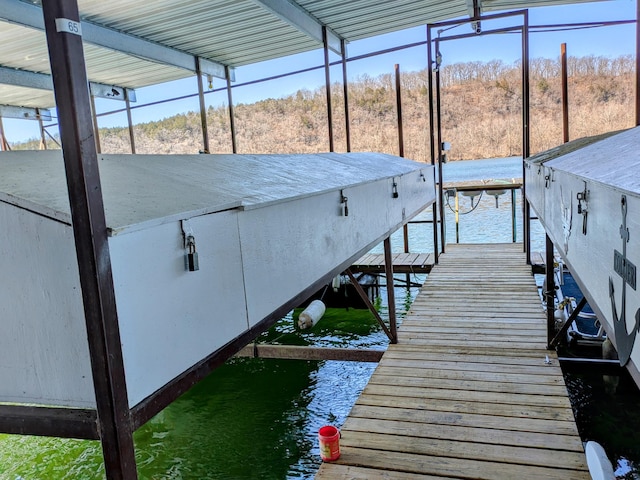 view of dock with a water view and boat lift