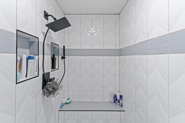 bathroom with a tile shower