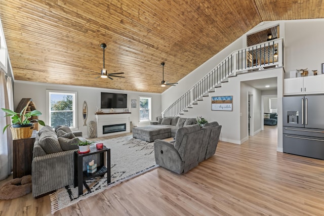 living room with light wood finished floors, wooden ceiling, stairs, and ceiling fan