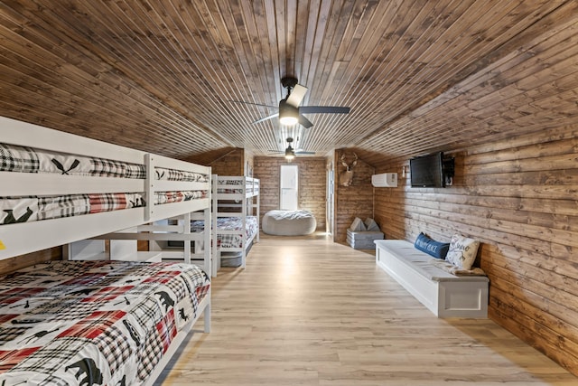 bedroom with wooden ceiling and wood finished floors