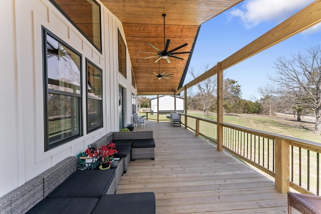 wooden terrace featuring ceiling fan