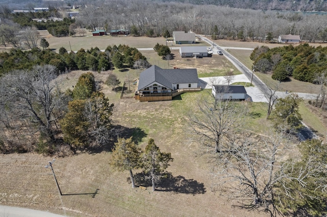 birds eye view of property with a rural view