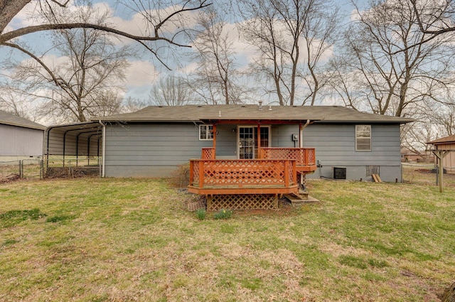 rear view of property with cooling unit, fence, a yard, a carport, and a deck