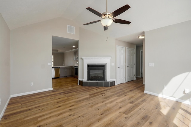 unfurnished living room featuring light wood-style flooring, baseboards, visible vents, and ceiling fan