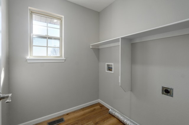 laundry room featuring visible vents, baseboards, washer hookup, laundry area, and electric dryer hookup