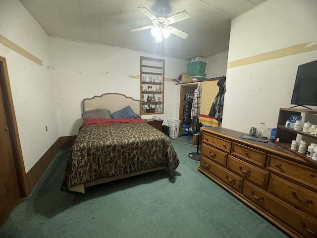 carpeted bedroom featuring a ceiling fan and a closet