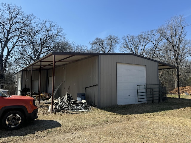 view of outbuilding featuring an outbuilding and dirt driveway