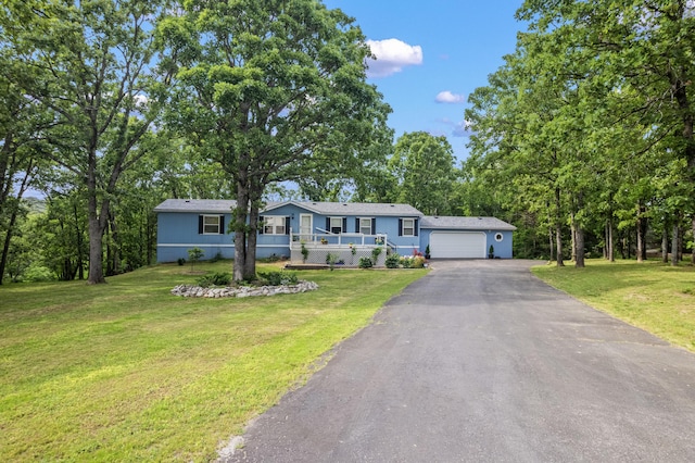 627 Reflection Rdg, Shell Knob, MO 65747 - ranch-style house with asphalt driveway, an attached garage, and a front lawn