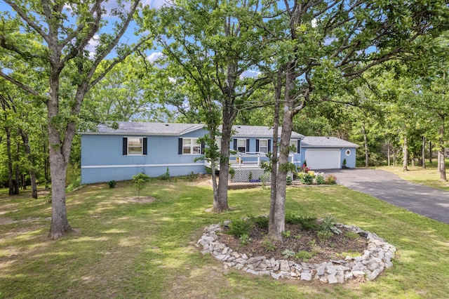 627 Reflection Rdg, Shell Knob, MO 65747 - view of front facade featuring asphalt driveway, a front yard, and an attached garage