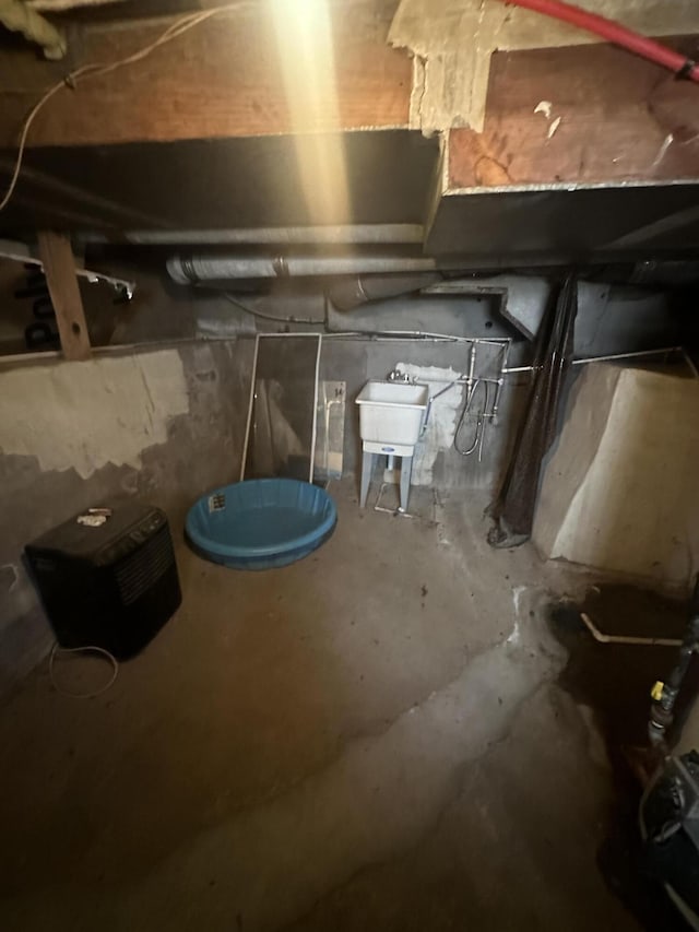 unfinished basement featuring a sink