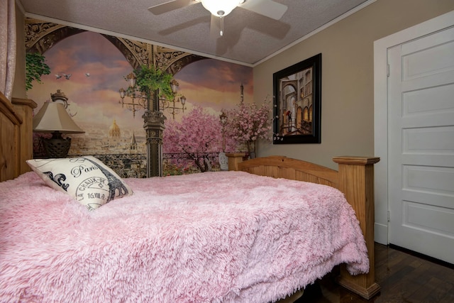 bedroom with ceiling fan, a textured ceiling, wood finished floors, and crown molding