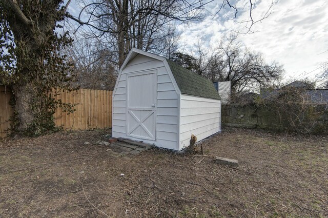 view of shed with a fenced backyard