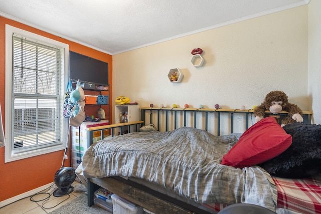 bedroom featuring multiple windows, crown molding, and baseboards