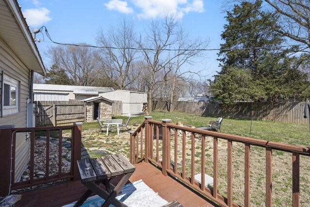 exterior space with a yard, an outbuilding, and a fenced backyard