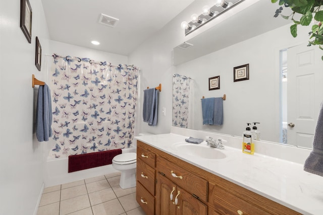 full bathroom featuring tile patterned flooring, visible vents, toilet, shower / tub combo with curtain, and vanity