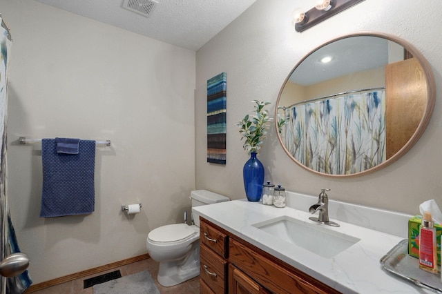 full bathroom featuring visible vents, toilet, a textured ceiling, and vanity