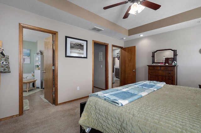 bedroom featuring visible vents, light carpet, baseboards, and ceiling fan