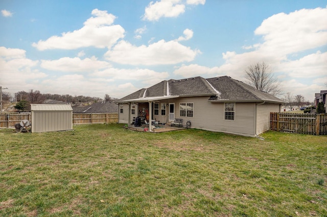 rear view of property with a patio area, a fenced backyard, a storage shed, and an outdoor structure