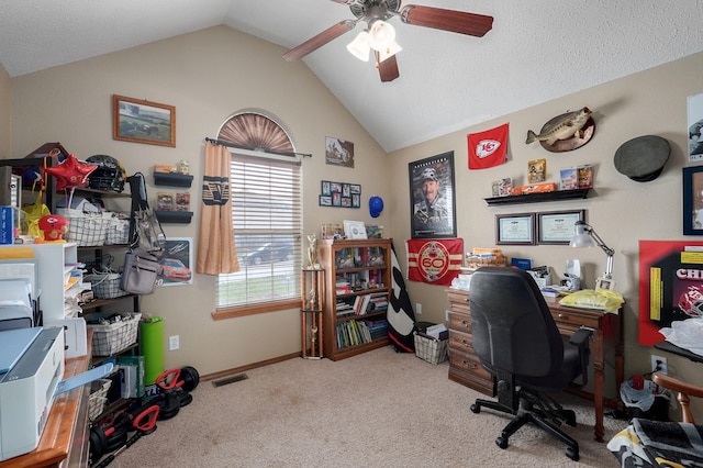 carpeted office space with visible vents, baseboards, lofted ceiling, a textured ceiling, and a ceiling fan