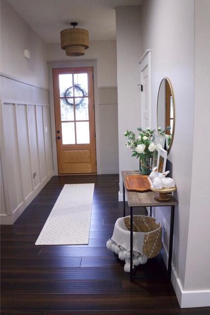 foyer featuring wood finished floors and baseboards