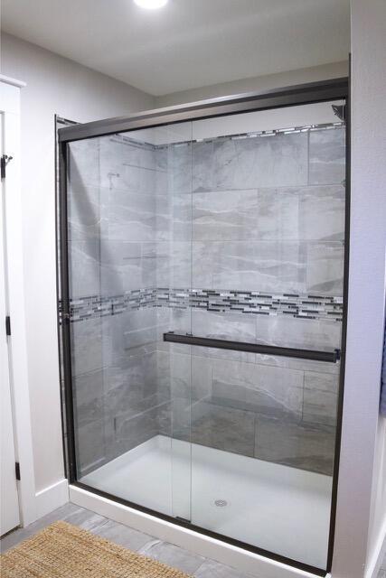 bathroom featuring a shower stall