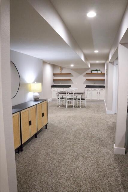 interior space with recessed lighting, baseboards, and carpet flooring