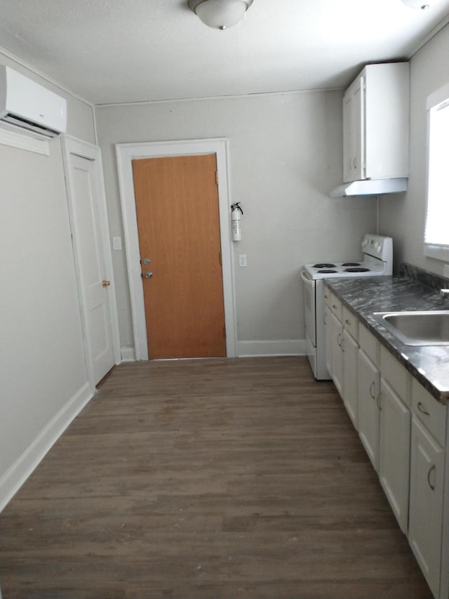 kitchen featuring white cabinetry, white electric stove, a wall mounted air conditioner, and a sink