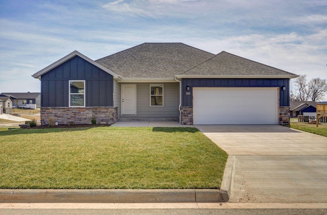 view of front facade with stone siding, board and batten siding, and driveway