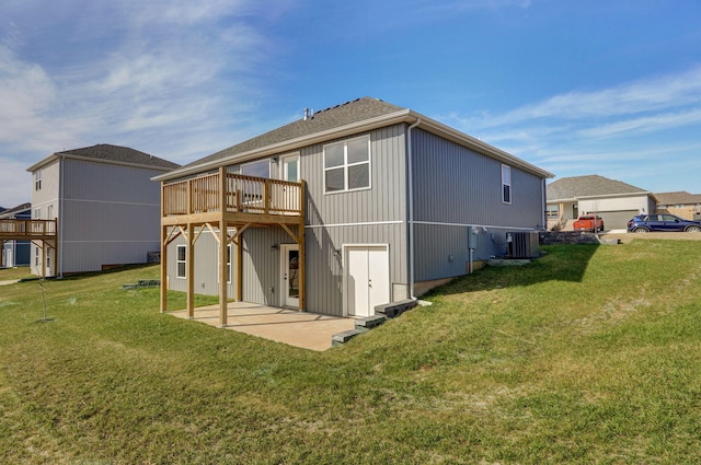 back of house featuring a deck, central air condition unit, a yard, and a patio area