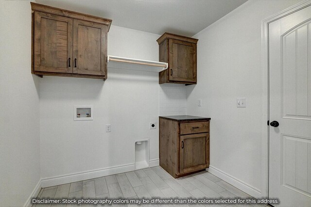 5202 S April Ct, Battlefield, MO 65619 - clothes washing area featuring baseboards, hookup for an electric dryer, cabinet space, washer hookup, and light wood-style floors