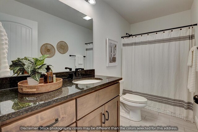 5202 S April Ct, Battlefield, MO 65619 - bathroom with toilet and vanity