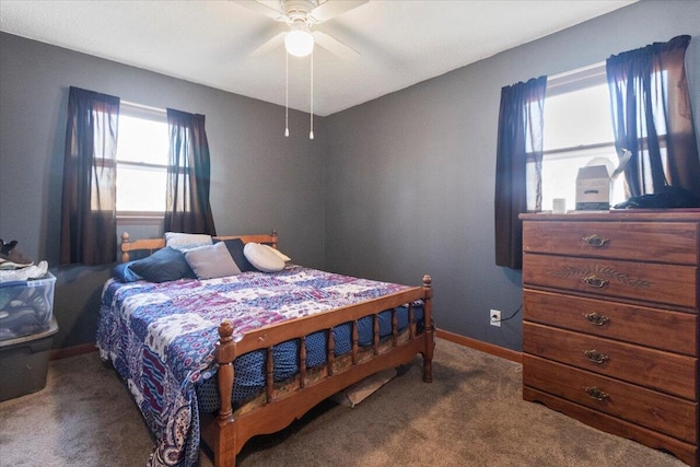 carpeted bedroom featuring a ceiling fan and baseboards