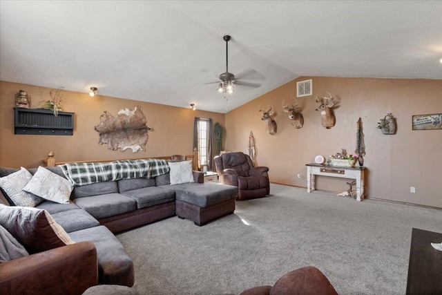 carpeted living area with vaulted ceiling, baseboards, visible vents, and ceiling fan