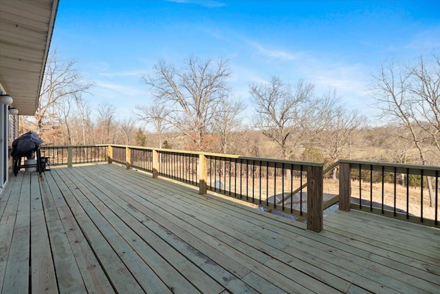 wooden terrace featuring grilling area