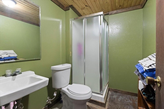 full bathroom featuring a shower stall, baseboards, toilet, wooden ceiling, and a sink