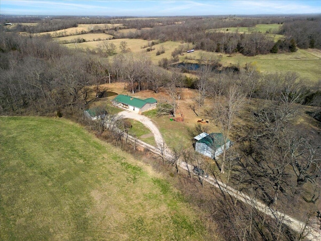 birds eye view of property featuring a rural view