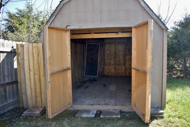 view of shed with fence