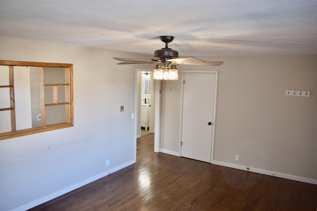 empty room featuring baseboards, ceiling fan, and wood finished floors