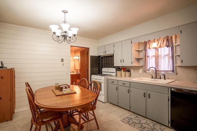 2457 County Road 1770, West Plains, MO 65775 - kitchen featuring a sink, black dishwasher, a notable chandelier, open shelves, and gas range gas stove