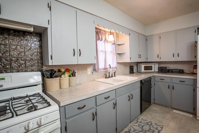 2457 County Road 1770, West Plains, MO 65775 - kitchen featuring a sink, gray cabinets, tasteful backsplash, and white appliances