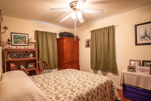 2457 County Road 1770, West Plains, MO 65775 - bedroom featuring wood finished floors, ceiling fan, and baseboards