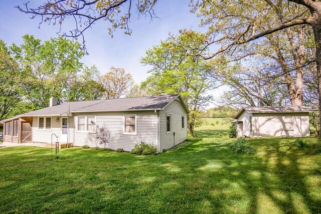 2457 County Road 1770, West Plains, MO 65775 - rear view of property featuring a yard and a chimney
