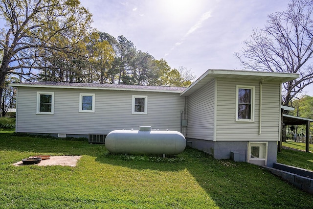 2457 County Road 1770, West Plains, MO 65775 - back of house featuring a fire pit and a yard