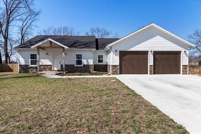 ranch-style home with a front lawn, stone siding, fence, concrete driveway, and a garage