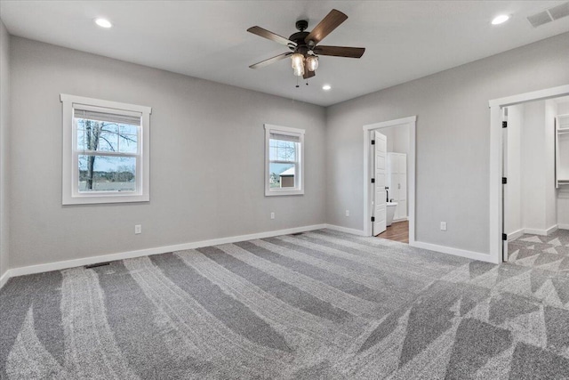 unfurnished bedroom with recessed lighting, visible vents, carpet floors, and baseboards