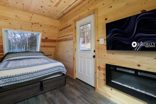 84 County Road 104, Gainesville, MO 65655 - bedroom featuring dark wood finished floors, wooden walls, and wood ceiling