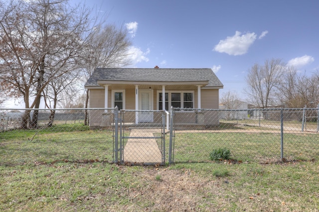 bungalow-style house featuring a front yard, a gate, fence private yard, and a shingled roof