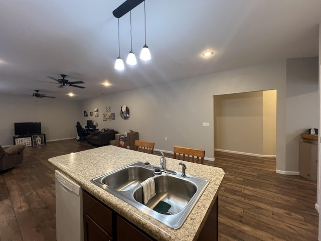 610 N Center St, Willow Springs, MO 65793 - kitchen with dark wood-style floors, open floor plan, white dishwasher, and a sink