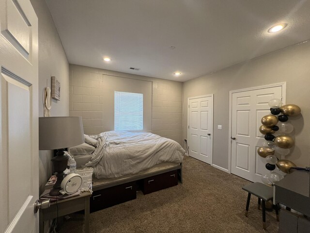 610 N Center St, Willow Springs, MO 65793 - bedroom with recessed lighting, visible vents, and dark carpet
